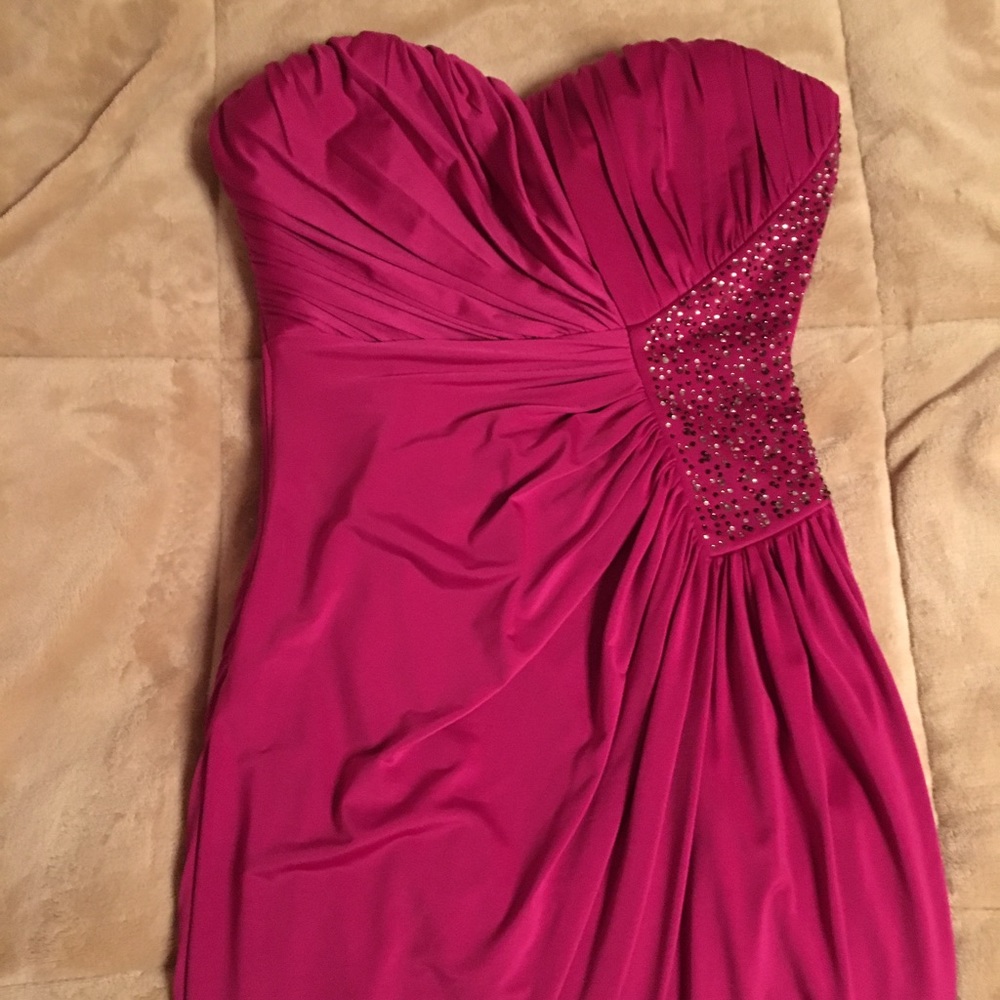 Fushia dress with purple and clear gems on back