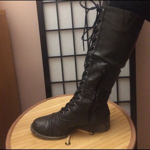 Knee high laced up boots