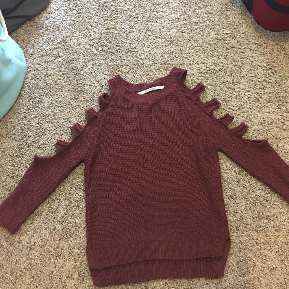 A maroon, lightly worn, LF sweater