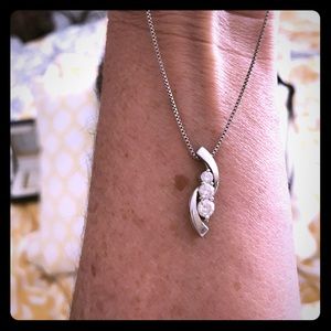 14 kt white gold diamond pendent with chain.