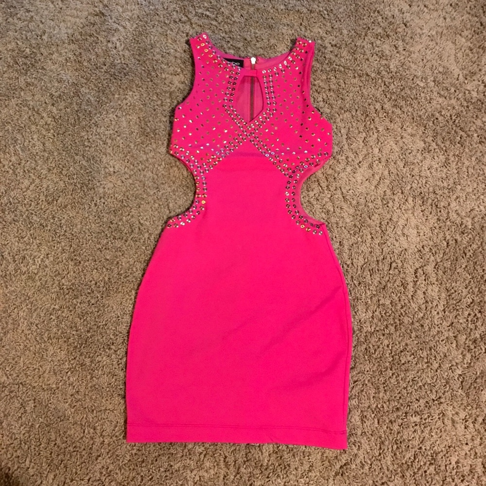 Hot pink cut out dress with silver stud outline.