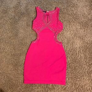 Hot pink cut out dress with silver stud outline.