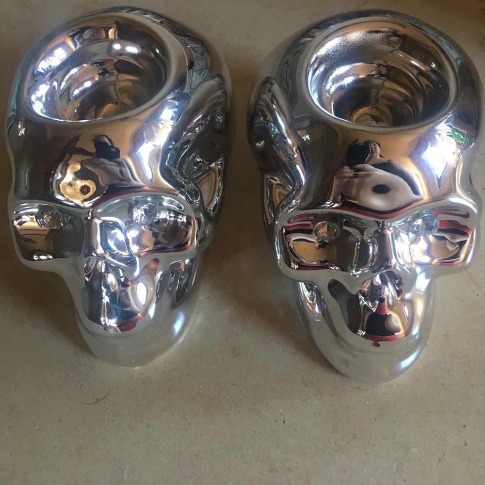 2 skull candle holders