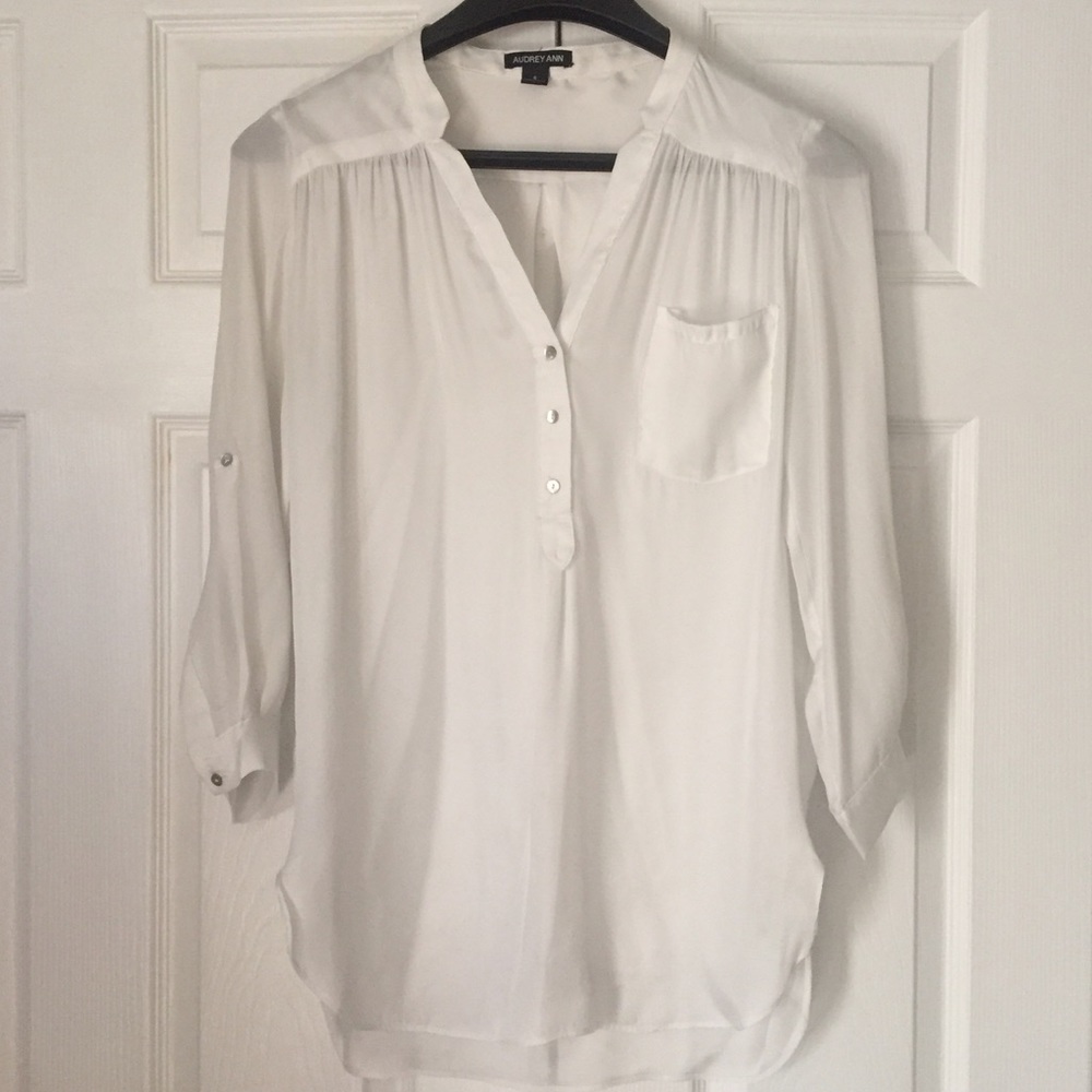 White satin blouse with fun details.