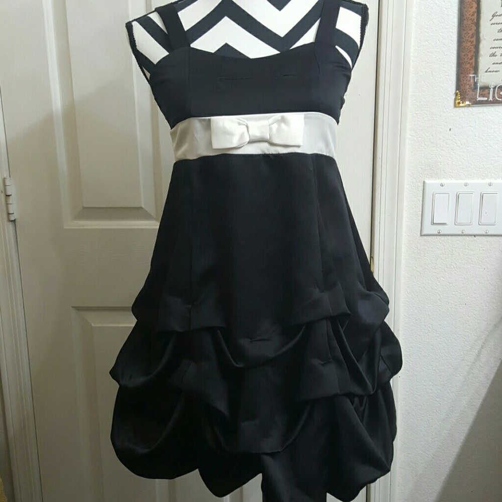 Beautiful black satin dress with white tie and bow