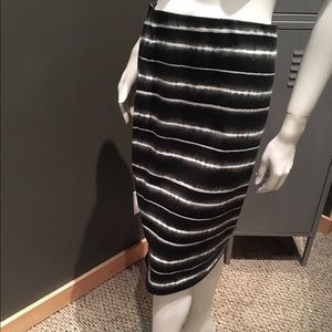 Knee length, high waist, pencil skirt.