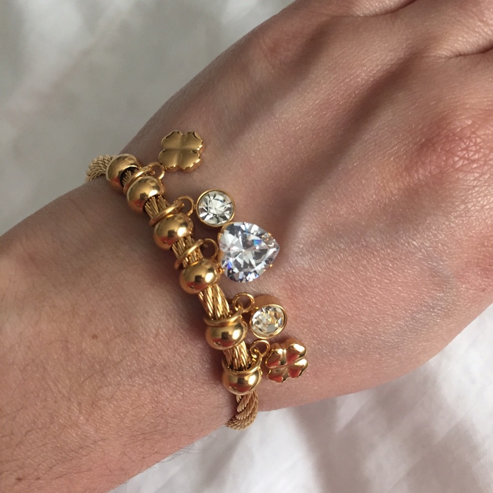 Gold stainless steel charm wire bracelet