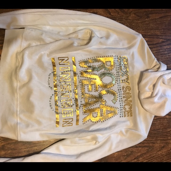 white and gold jogging suit