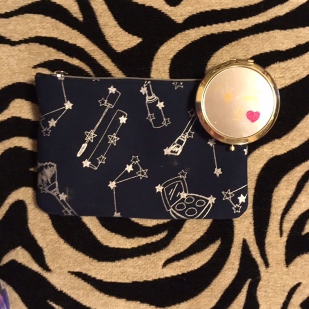 Blue makeup bag and emoji compact mirror