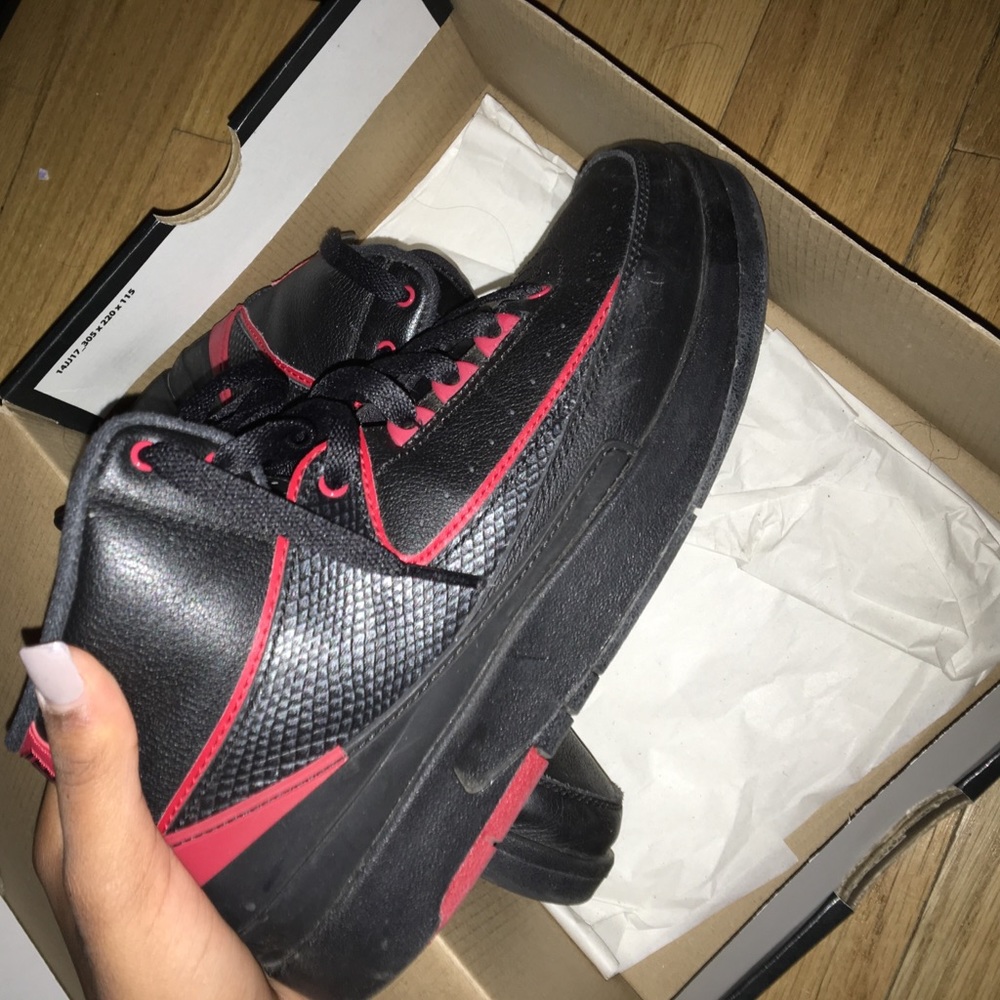 Black and red Jordan 2's