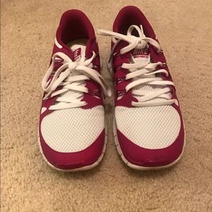 Pink and white Nike frees