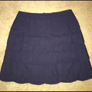 Navy blue scalloped skirt.