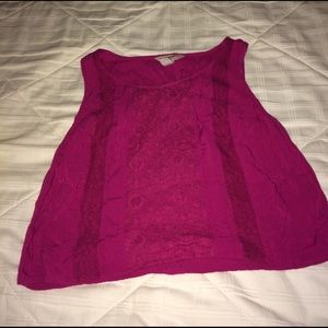 A maroon colored crop tank