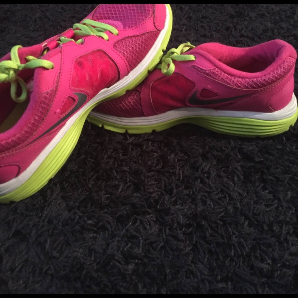Pink and green Nike running shoes
