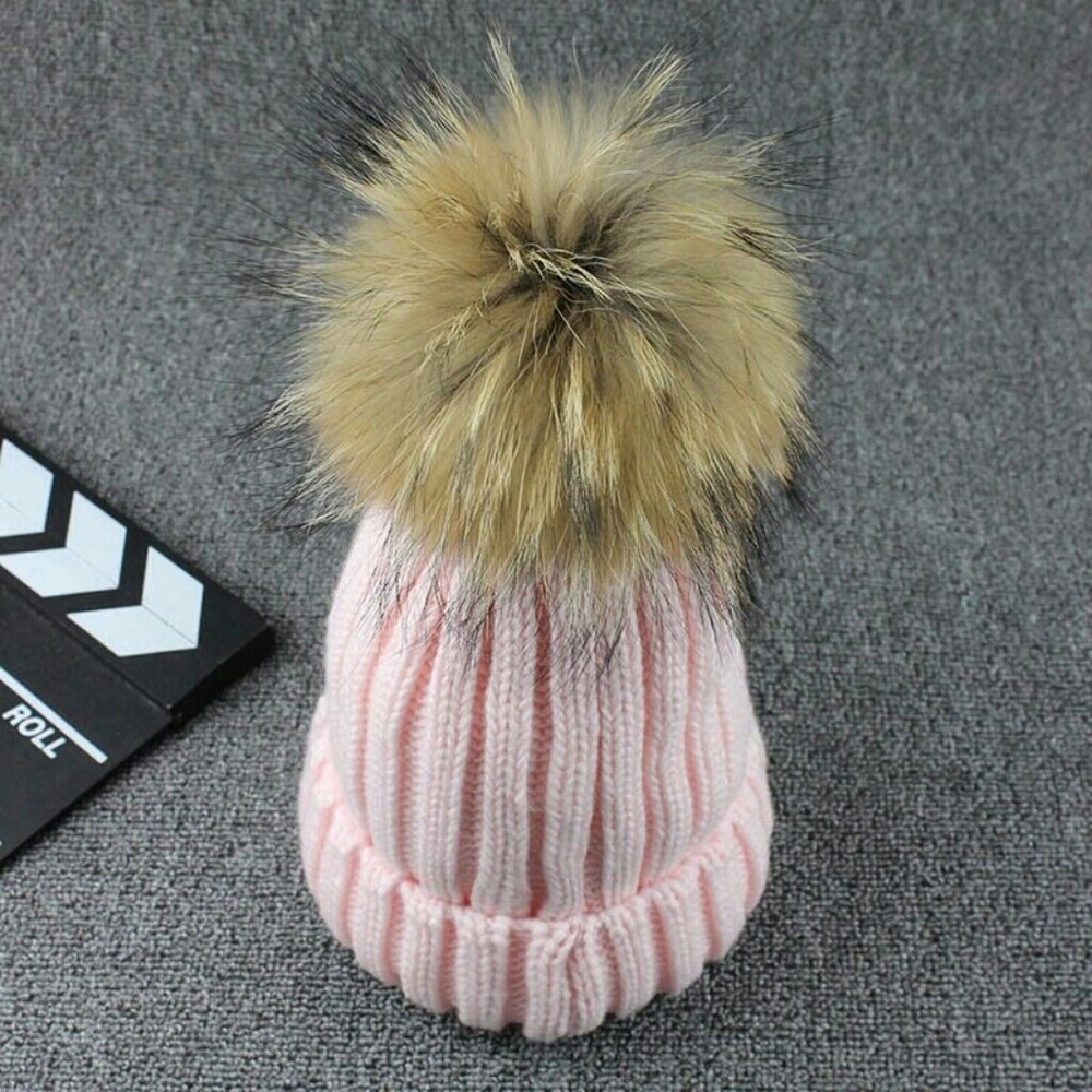 Knit hat with faux fur pom pom