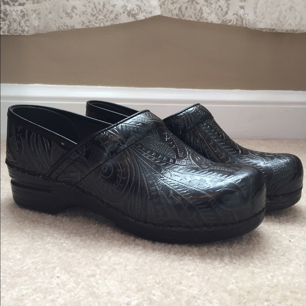 Dansko black tooled leather shoes.