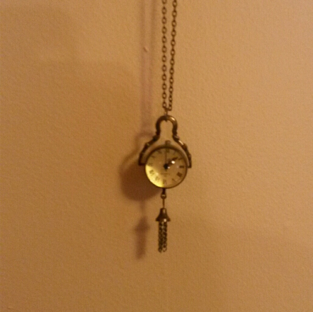 Long gold tone watch necklace