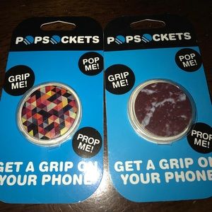 Two mobile phone grip/pop sockets