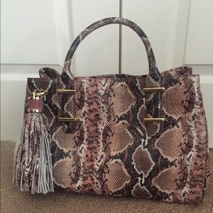 Leather handbag in python print