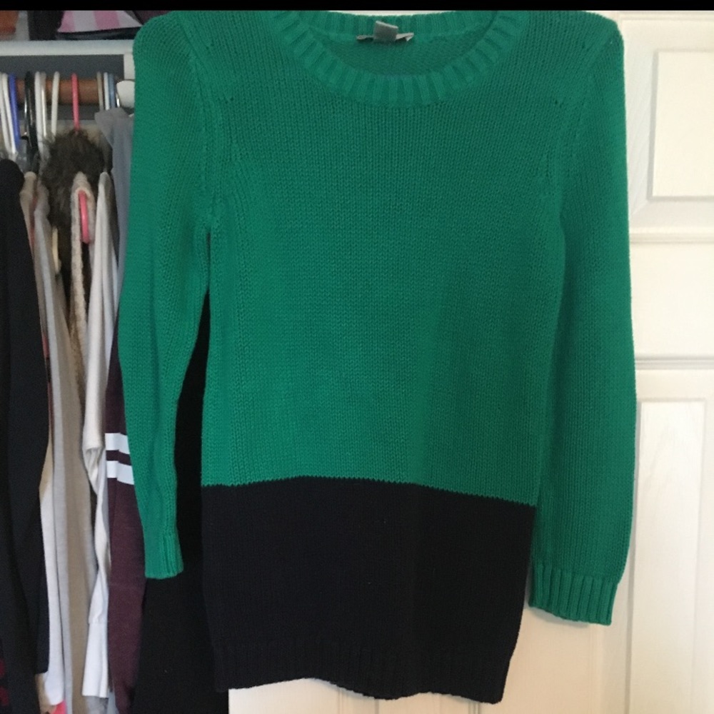 Green and black sweater.