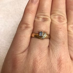Gold ring blue stone with small diamond accent