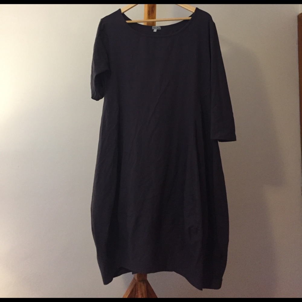 Beautifully shaped, plum colored tapered dress