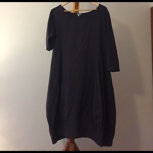 Beautifully shaped, plum colored tapered dress
