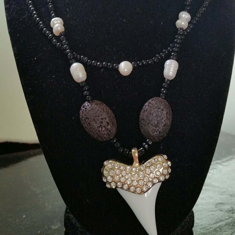 Crystal shark tooth, lava rock, and pearl necklace