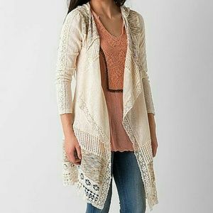 Long sweater with woven cutouts