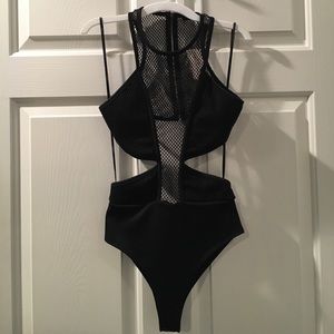 Brand New! Mesh cut out bodysuit size small!