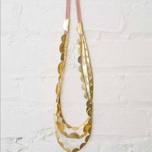 Roost gold half moon necklace, sold at anthro.