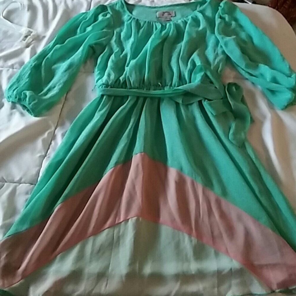 Mint multi colored dress with slits in sleeves.