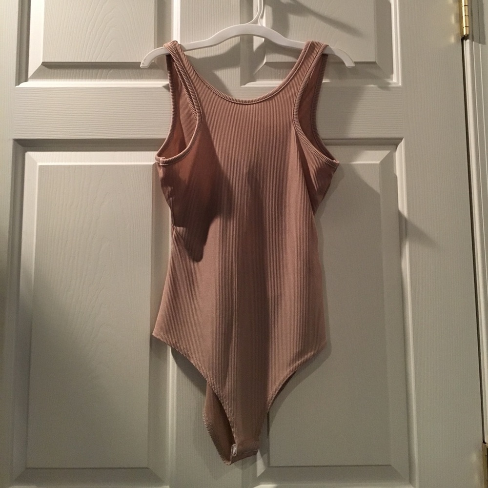 Brand New with tags nude bodysuit!