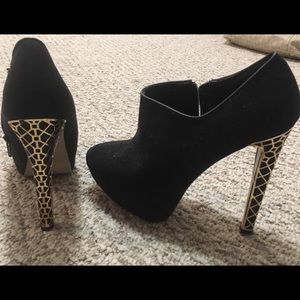 Call it Spring black booties with gold detail