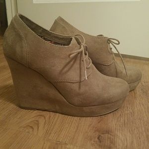 Sueded wedge booties with laces.