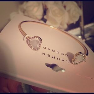 Gold tone pearl and rhinestone heart bangle