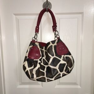 Printed red and giraffe purse