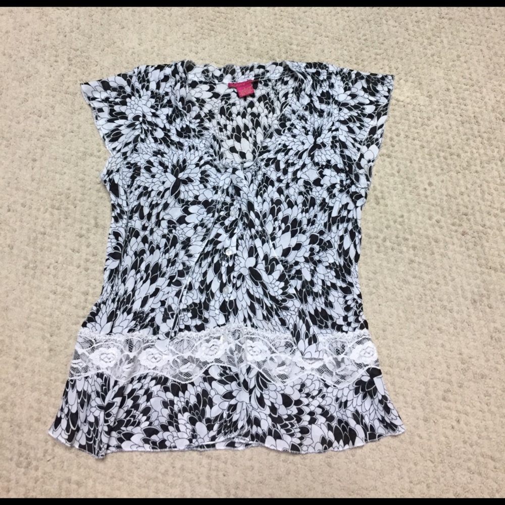 Black and white blouse .