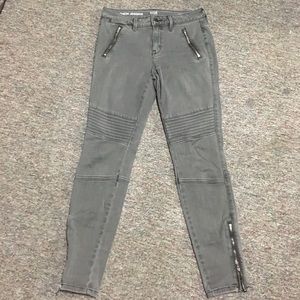 Dark gray moto jeans.