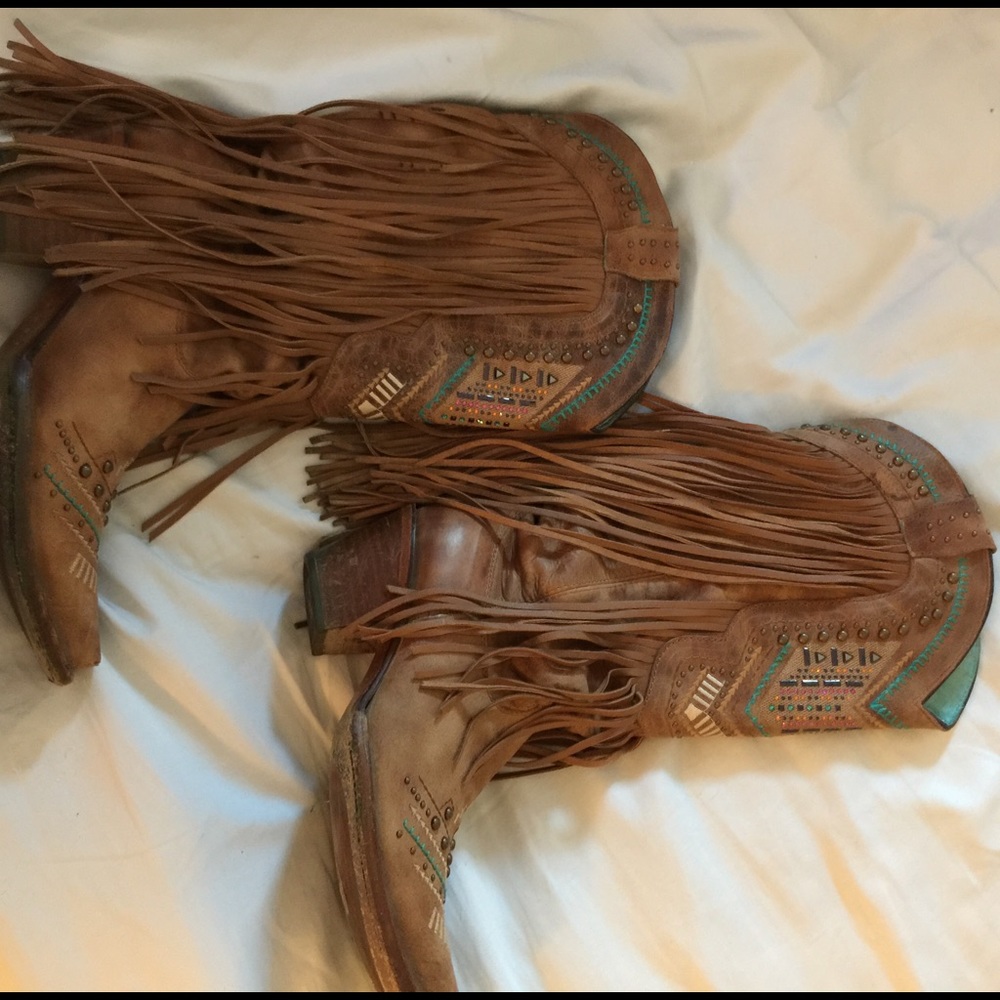 Brown fringe cowboy boots corral