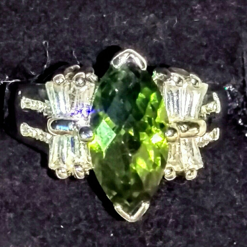 Used Peridot &  brilliant man made diamonds ring