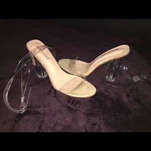 Clear strap heel sandals with silver button.