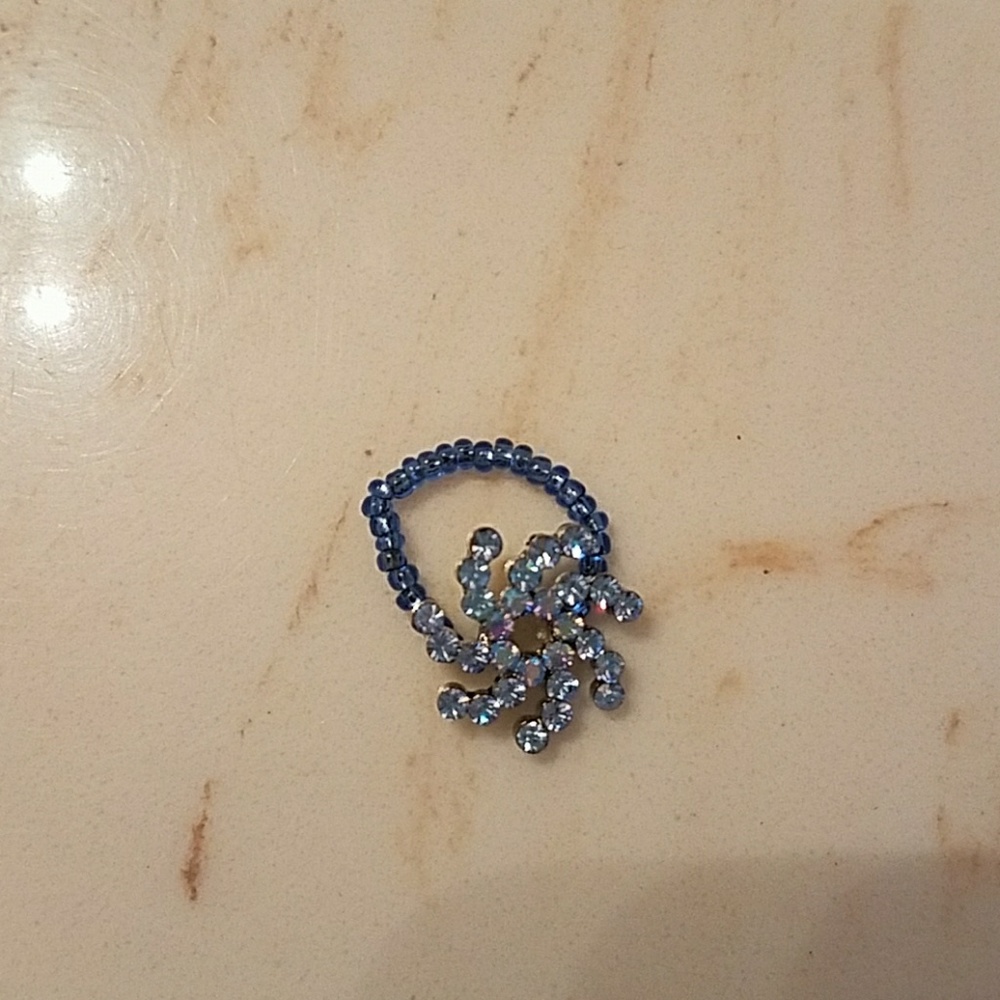 Brand new blue flower ring.