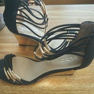 Aldo Black and Gold Strap Wedge Sandals