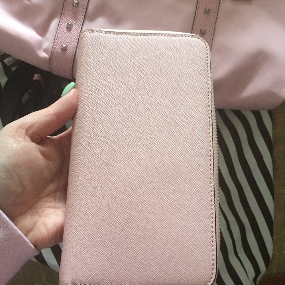 Light pink West 57th Henri Bendel wallet
