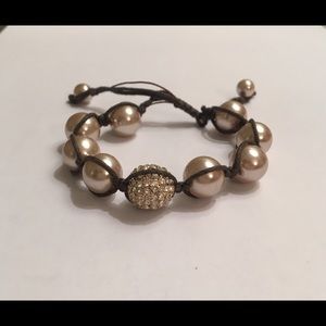 Gold costume pearl and cord adjustable bracelet