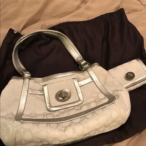 White and silver coach purse and wallet.