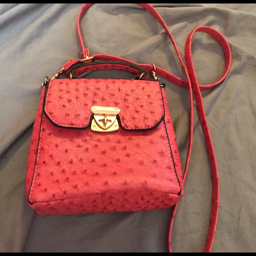 Small pink bag with adjustable cross body strap