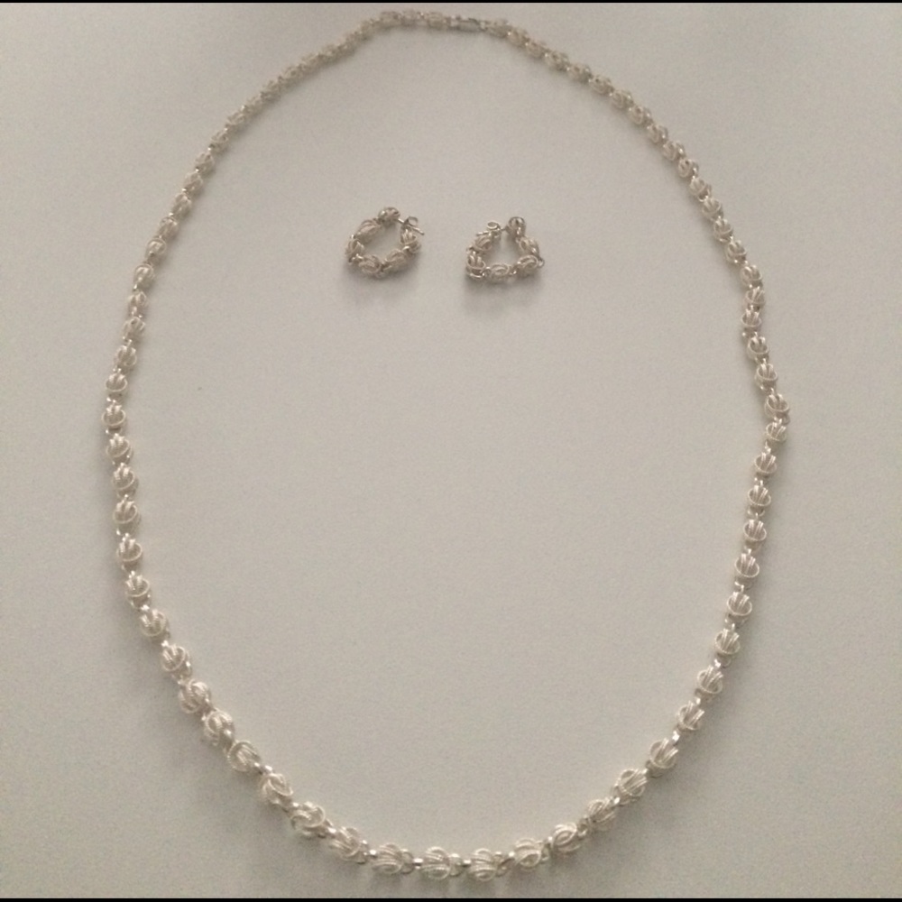NWOT Silver necklace and earrings set.