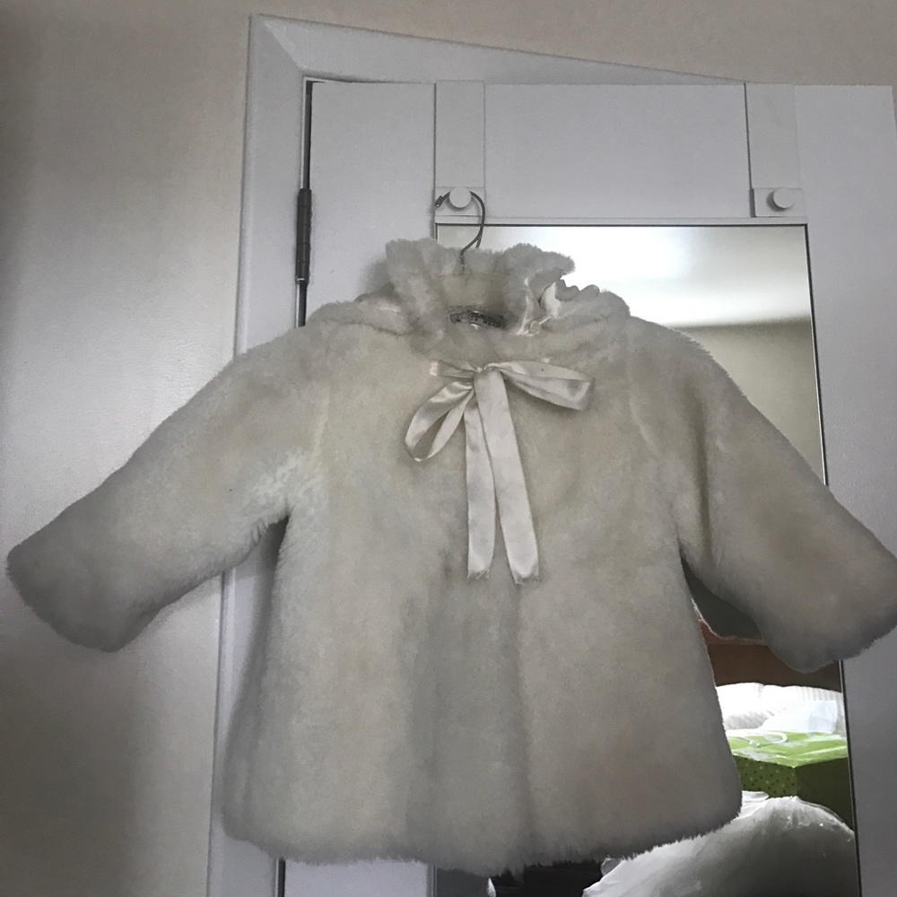 Faux fur coat with hood